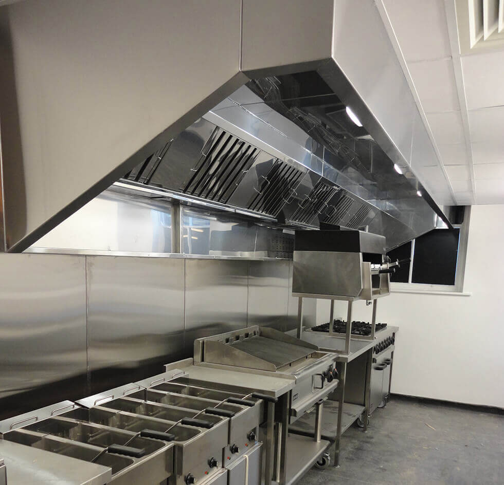 Stainless steel kitchen equipment and extraction canopy in the existing project reference image